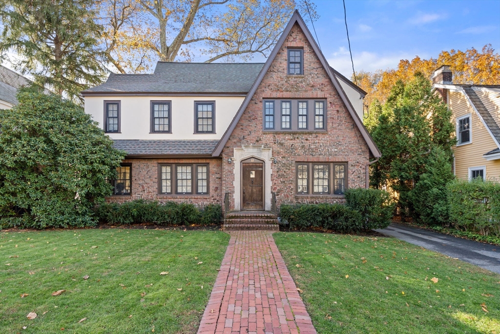 22 Brackett Road Newton, MA 02458 - Photo 1 of 1 a front view of a house with yard