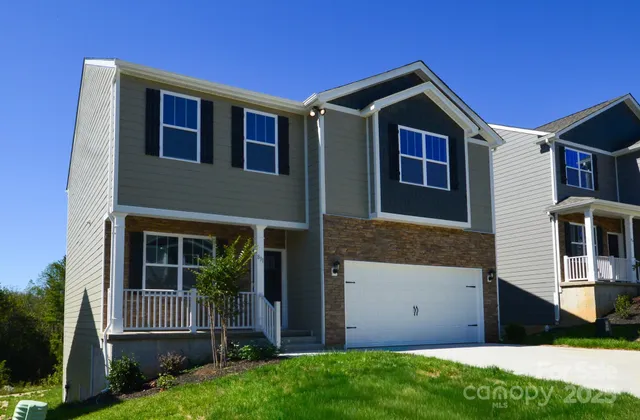 a kitchen with white cabinets stainless steel appliances and sink