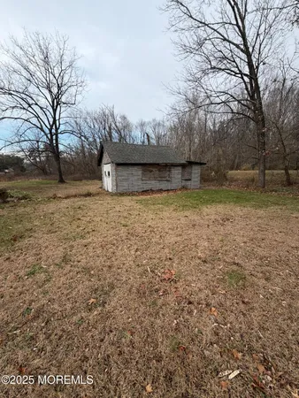 a view of backyard with green space
