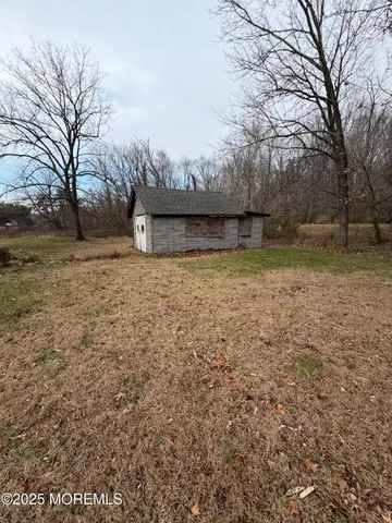 a view of backyard with green space