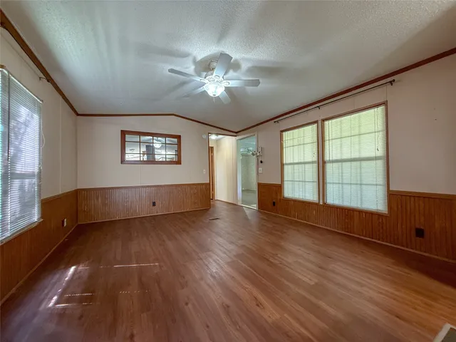 a kitchen with granite countertop stainless steel appliances and wooden cabinets