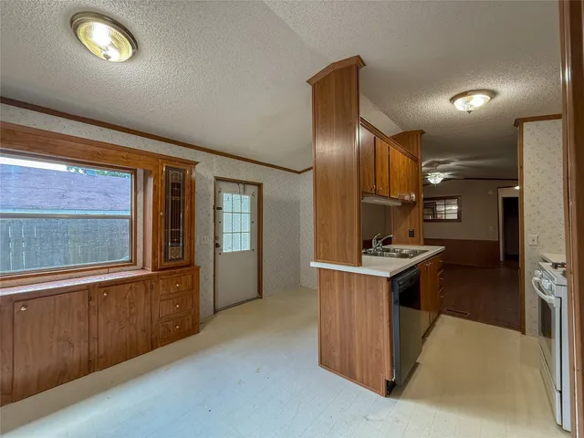 a kitchen with a stove and a sink