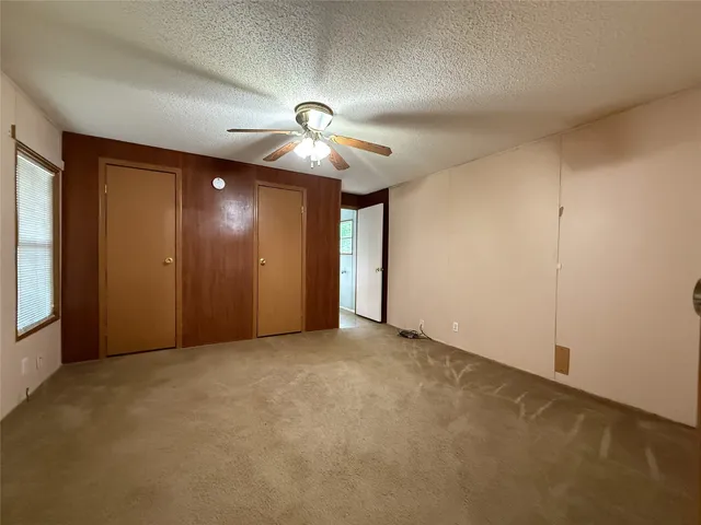 a bathroom with a toilet a sink and shower