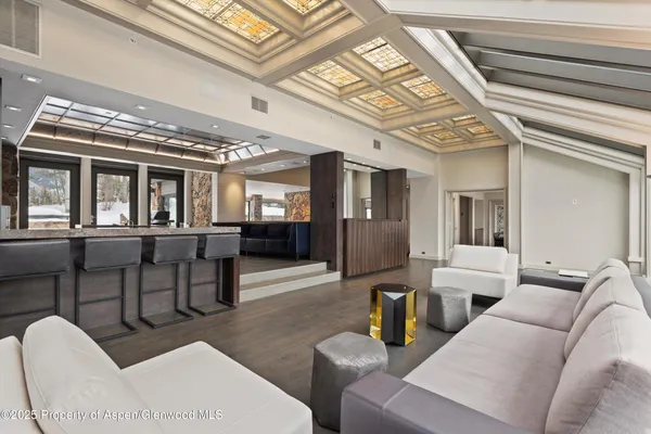 a kitchen with stainless steel appliances kitchen island granite countertop a stove and a sink