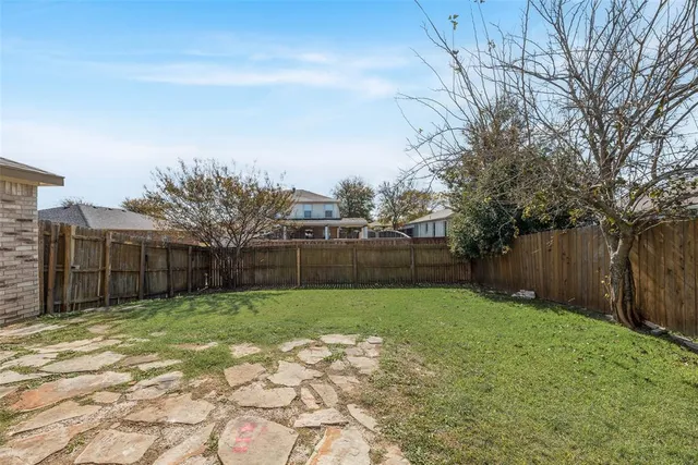 a bathroom with a tub a sink double vanity and a mirror