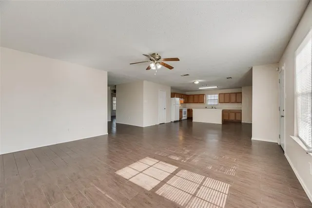 a view of a kitchen with a sink and a stove top oven