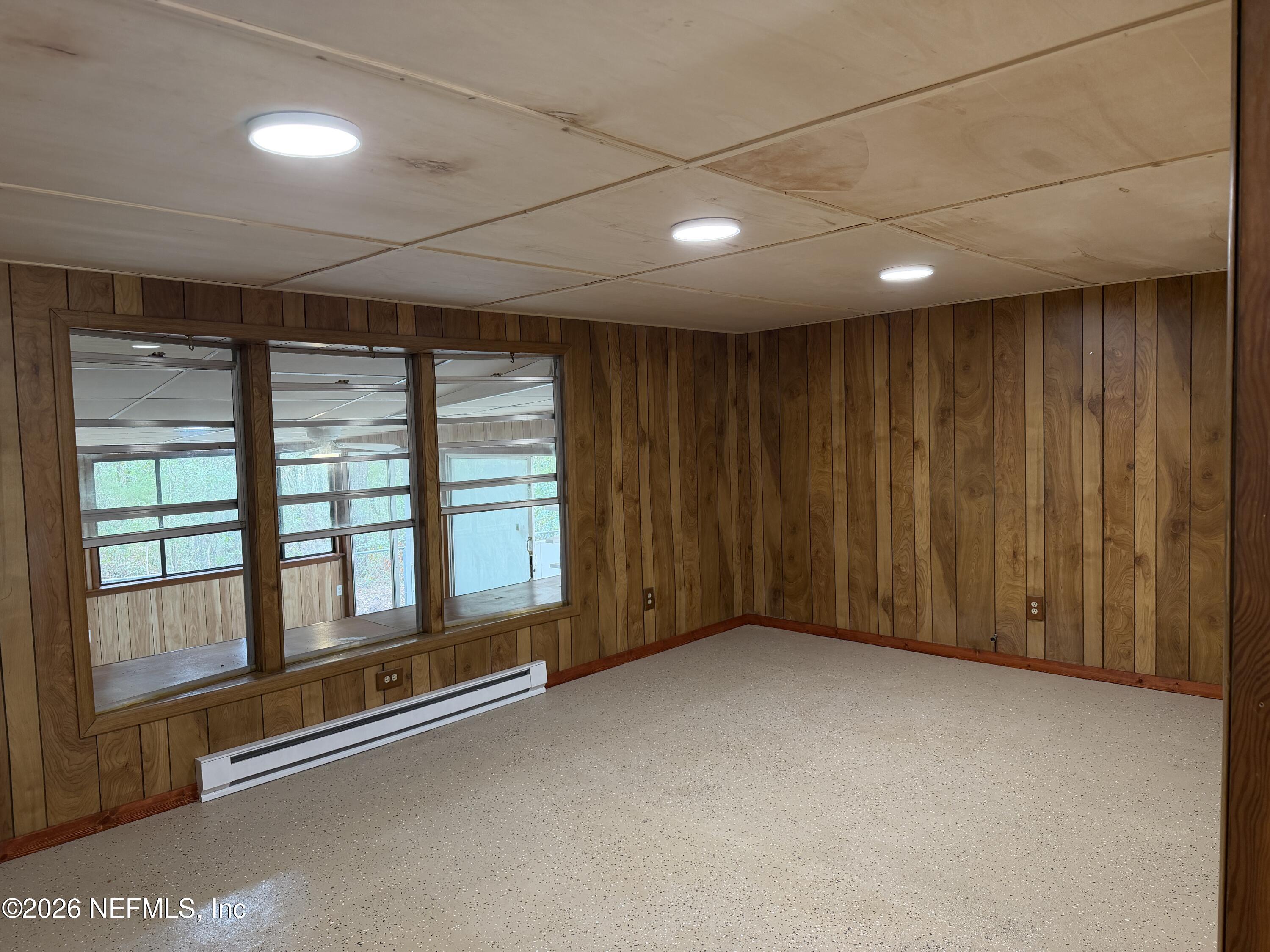 110 Kitty Lane Interlachen, FL 32148 - Photo 11 of 14 a view of an empty room with a window