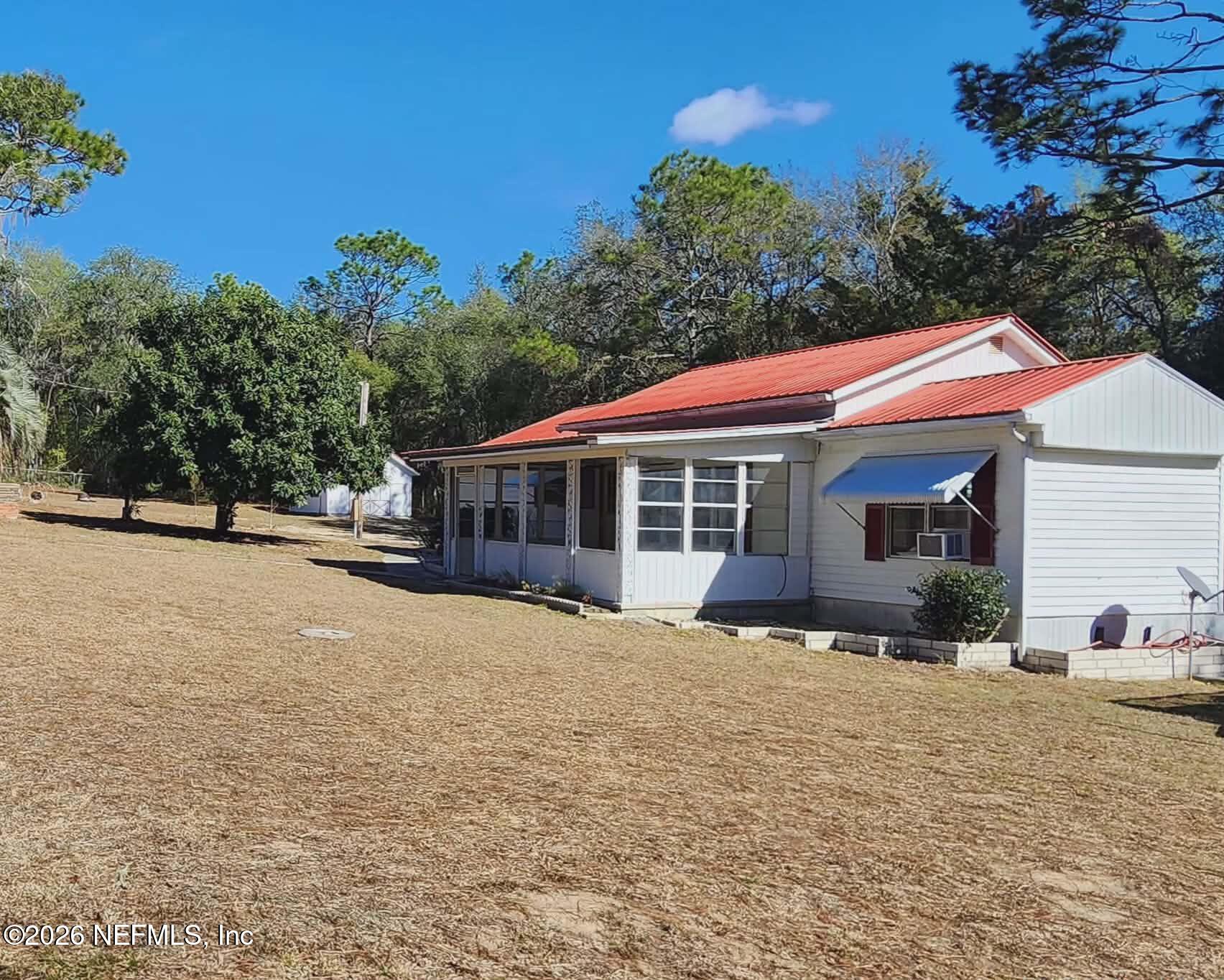 110 Kitty Lane Interlachen, FL 32148 - Photo 3 of 14 a front view of a house with a yard