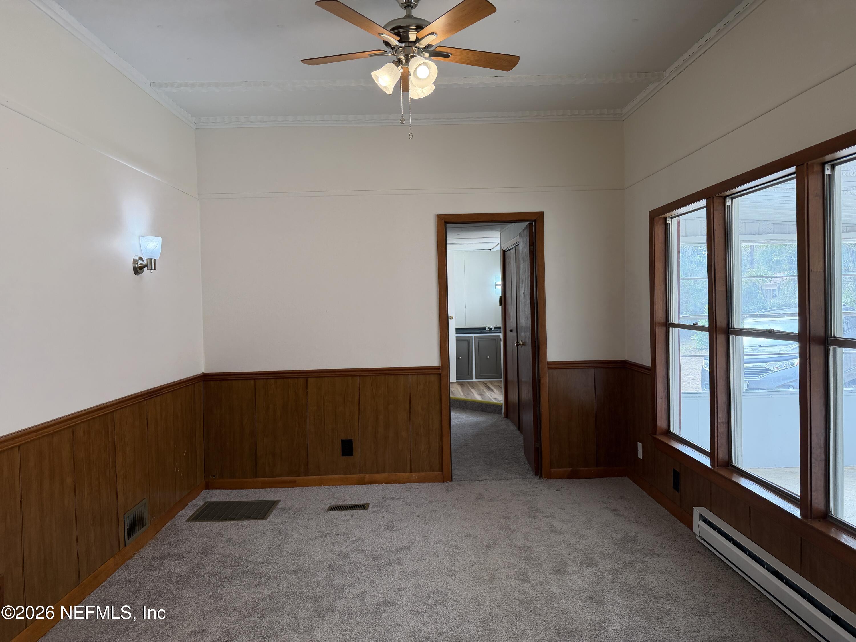 110 Kitty Lane Interlachen, FL 32148 - Photo 10 of 14 an empty room with windows and closet
