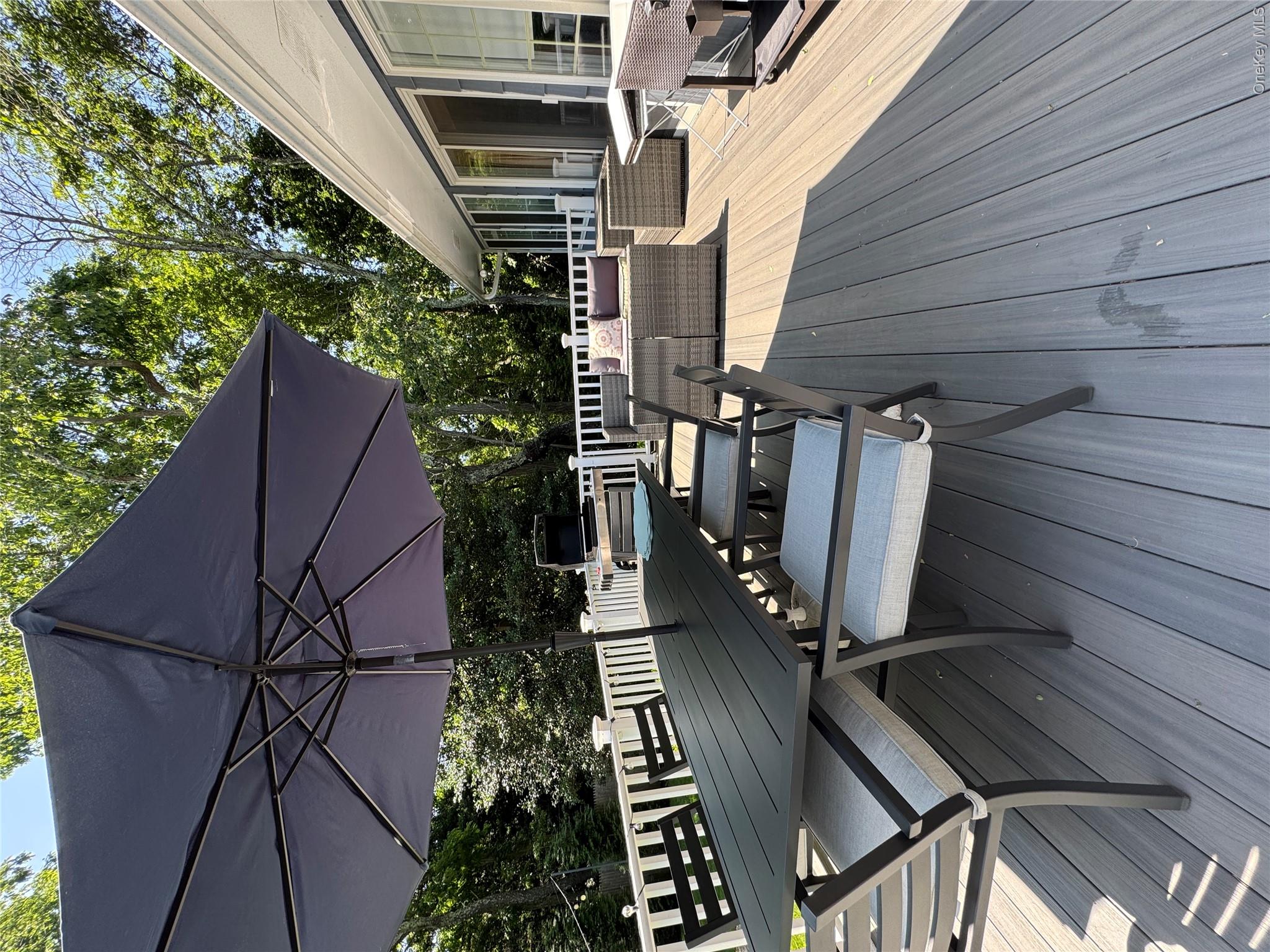 870 Noyack Road Southampton, NY 11968 - Photo 14 of 19 a view of a terrace with sitting area