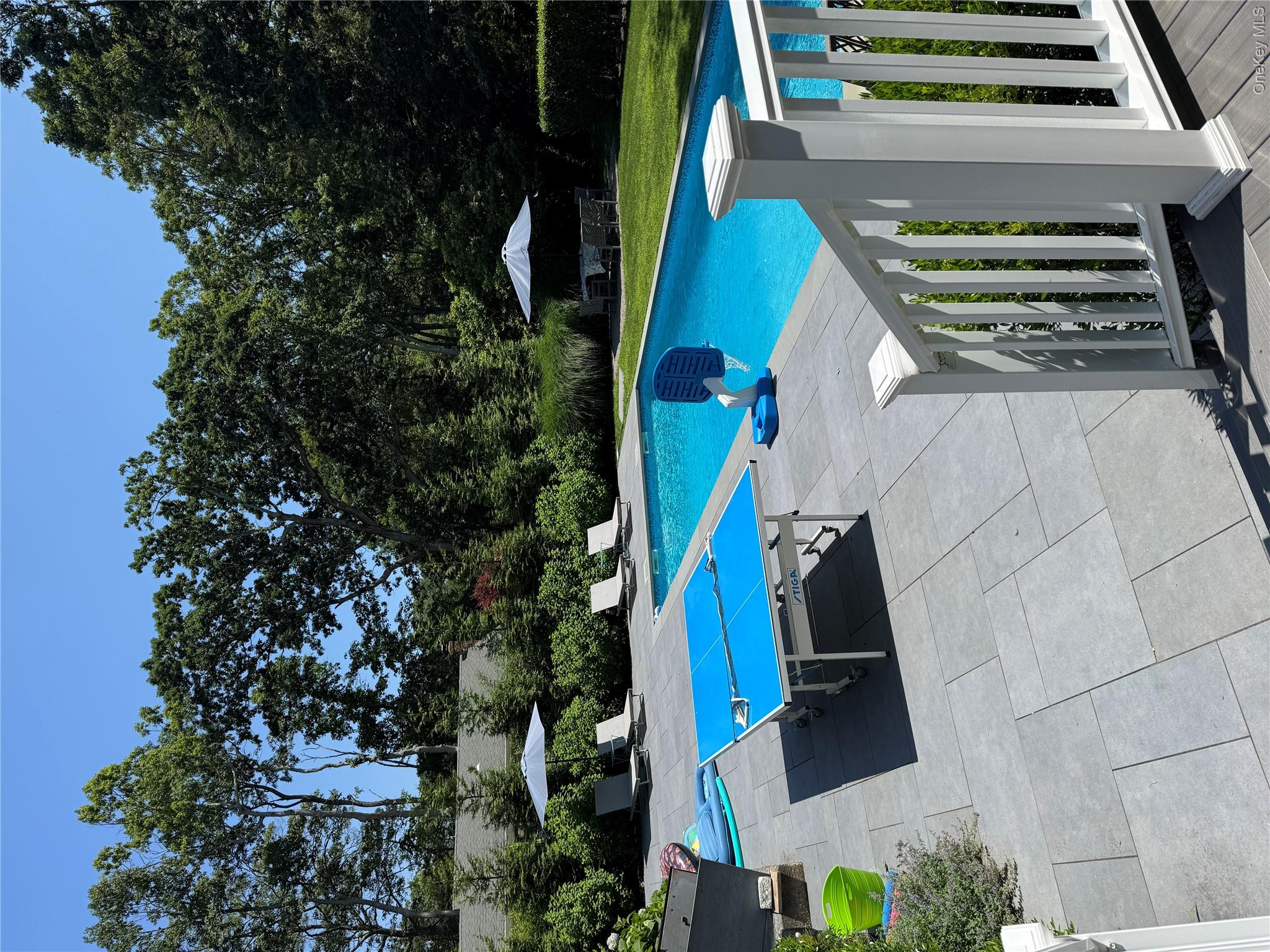 870 Noyack Road Southampton, NY 11968 - Photo 15 of 19 a view of outdoor space yard swimming pool and seating