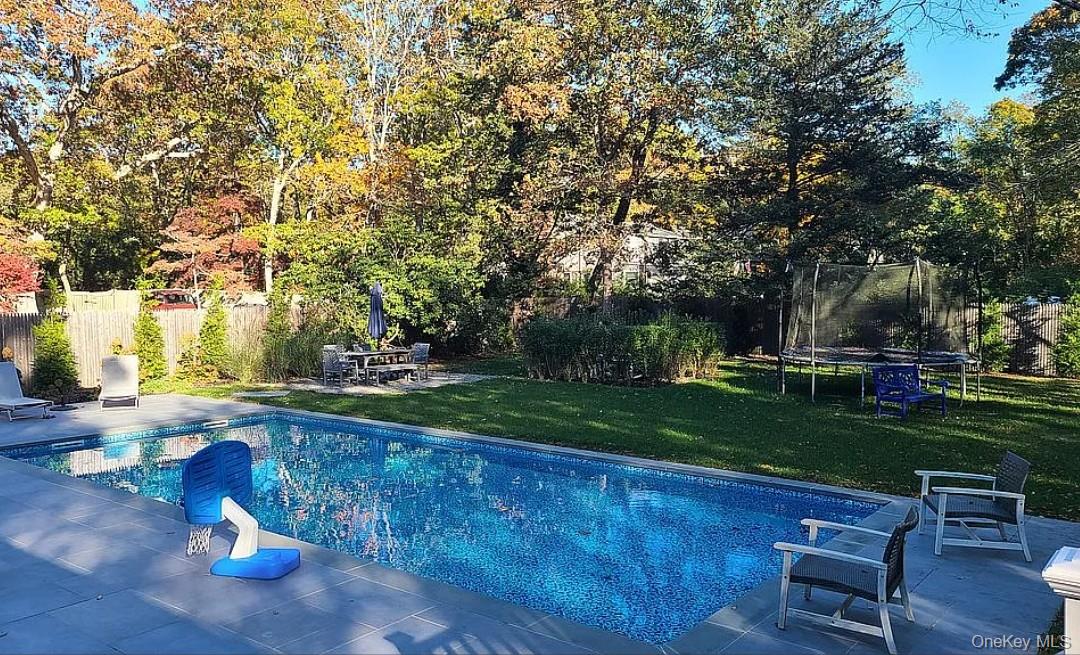 870 Noyack Road Southampton, NY 11968 - Photo 17 of 19 a view of a backyard with sitting area