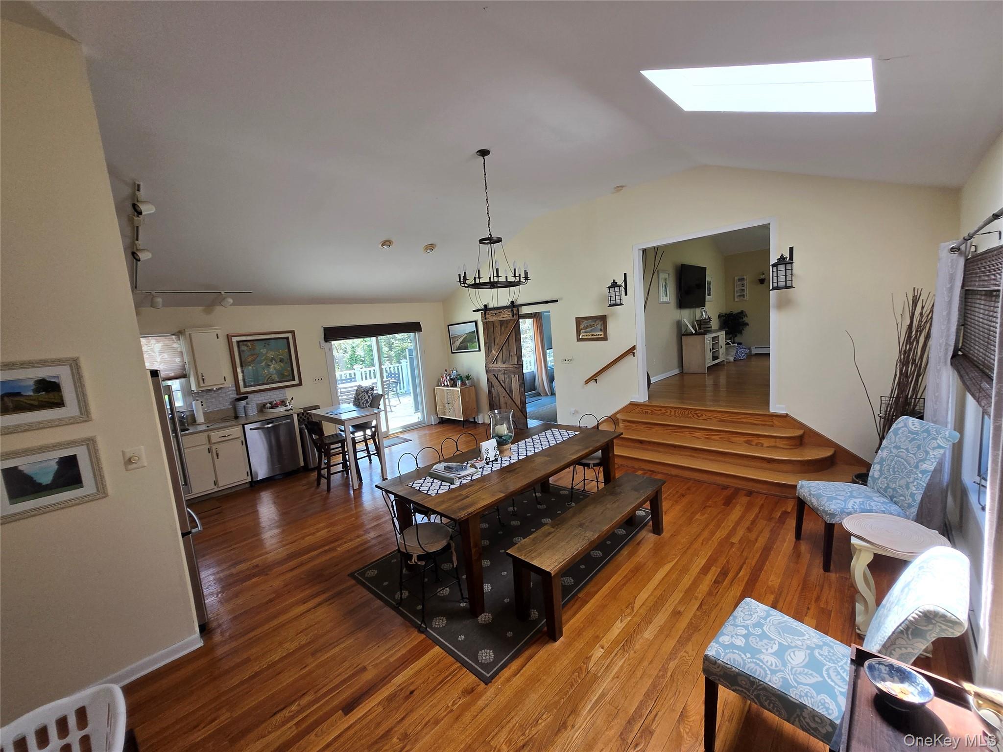870 Noyack Road Southampton, NY 11968 - Photo 3 of 19 a living room with furniture a table and wooden floor