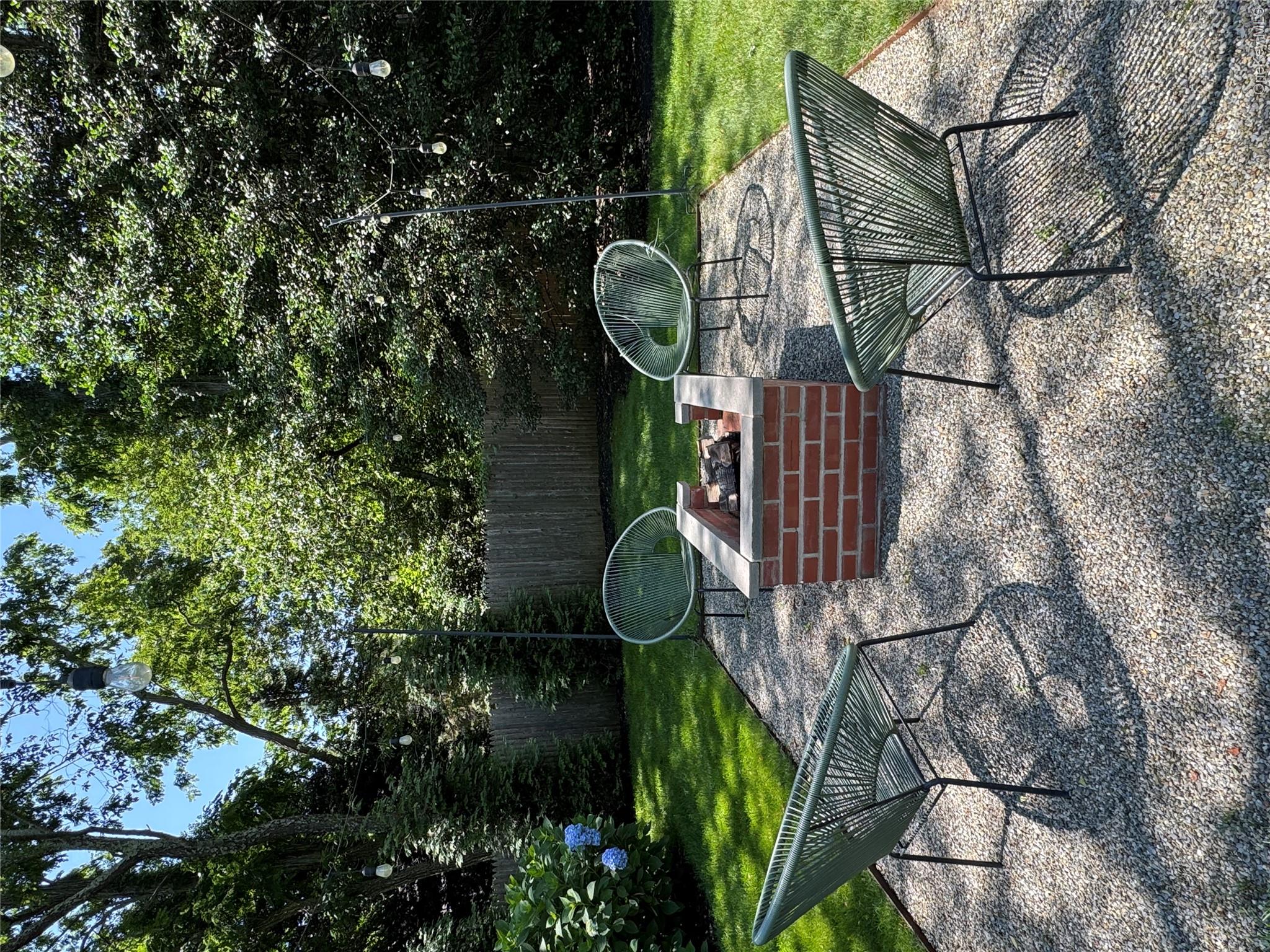 870 Noyack Road Southampton, NY 11968 - Photo 5 of 19 a view of a chairs and table in the patio