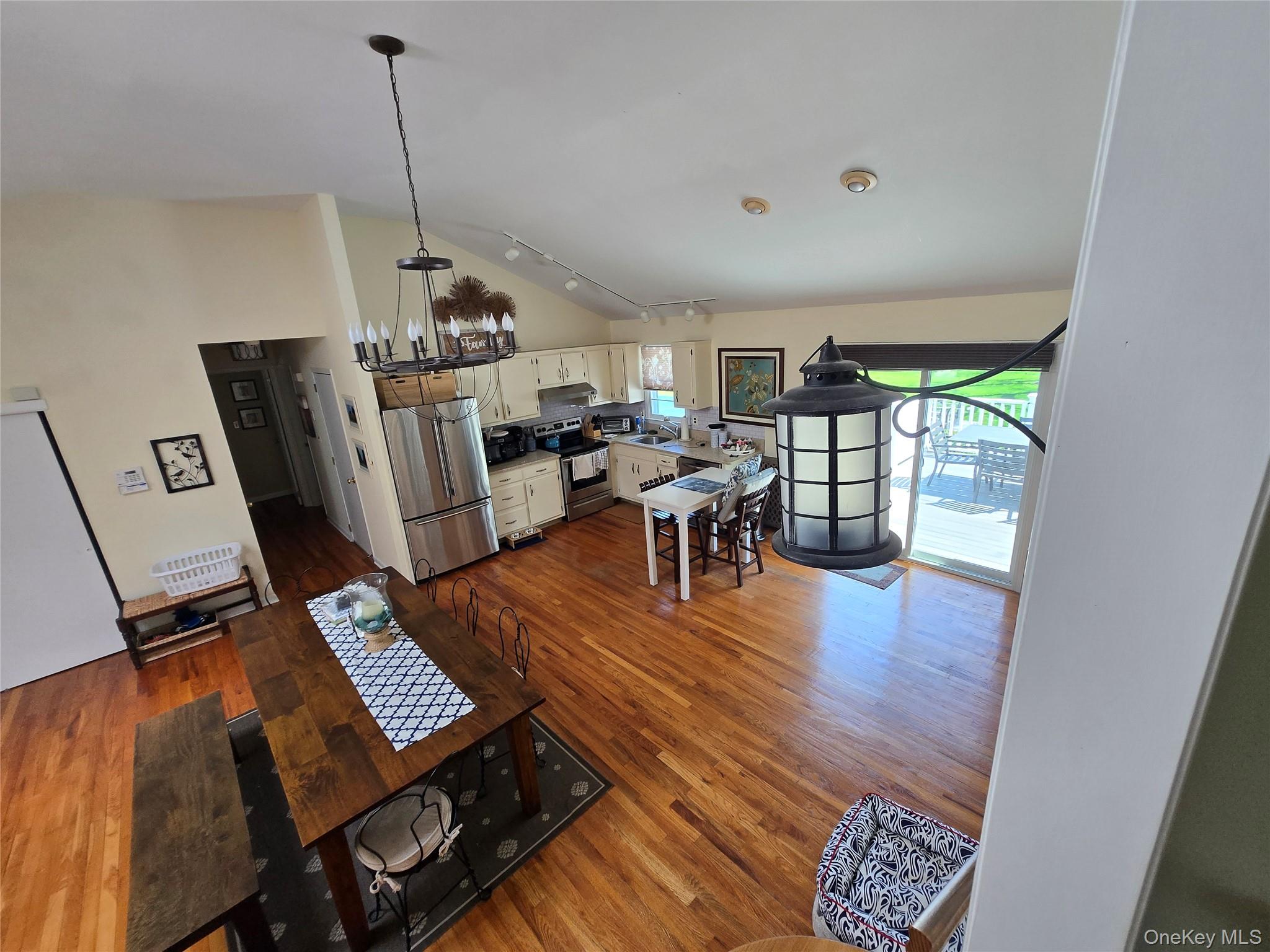 870 Noyack Road Southampton, NY 11968 - Photo 7 of 19 a living room with furniture and a wooden floor