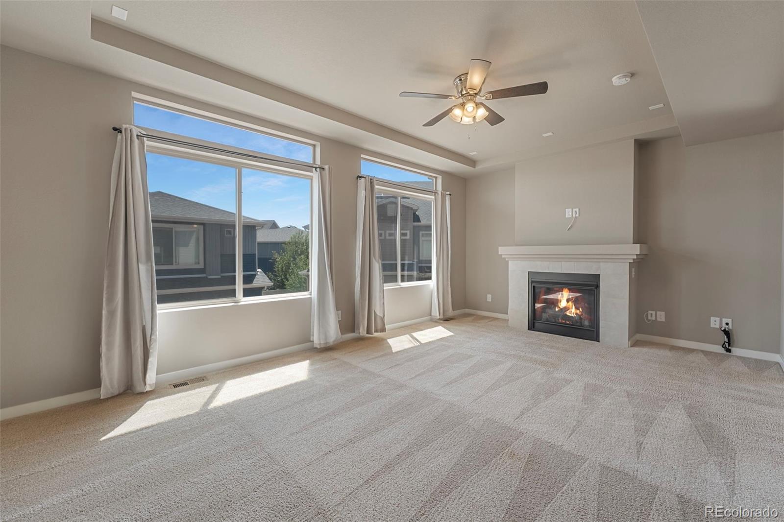 9528 Timberlake Loop Colorado Springs, CO 80927 - Photo 14 of 37 a view of an empty room with a fireplace