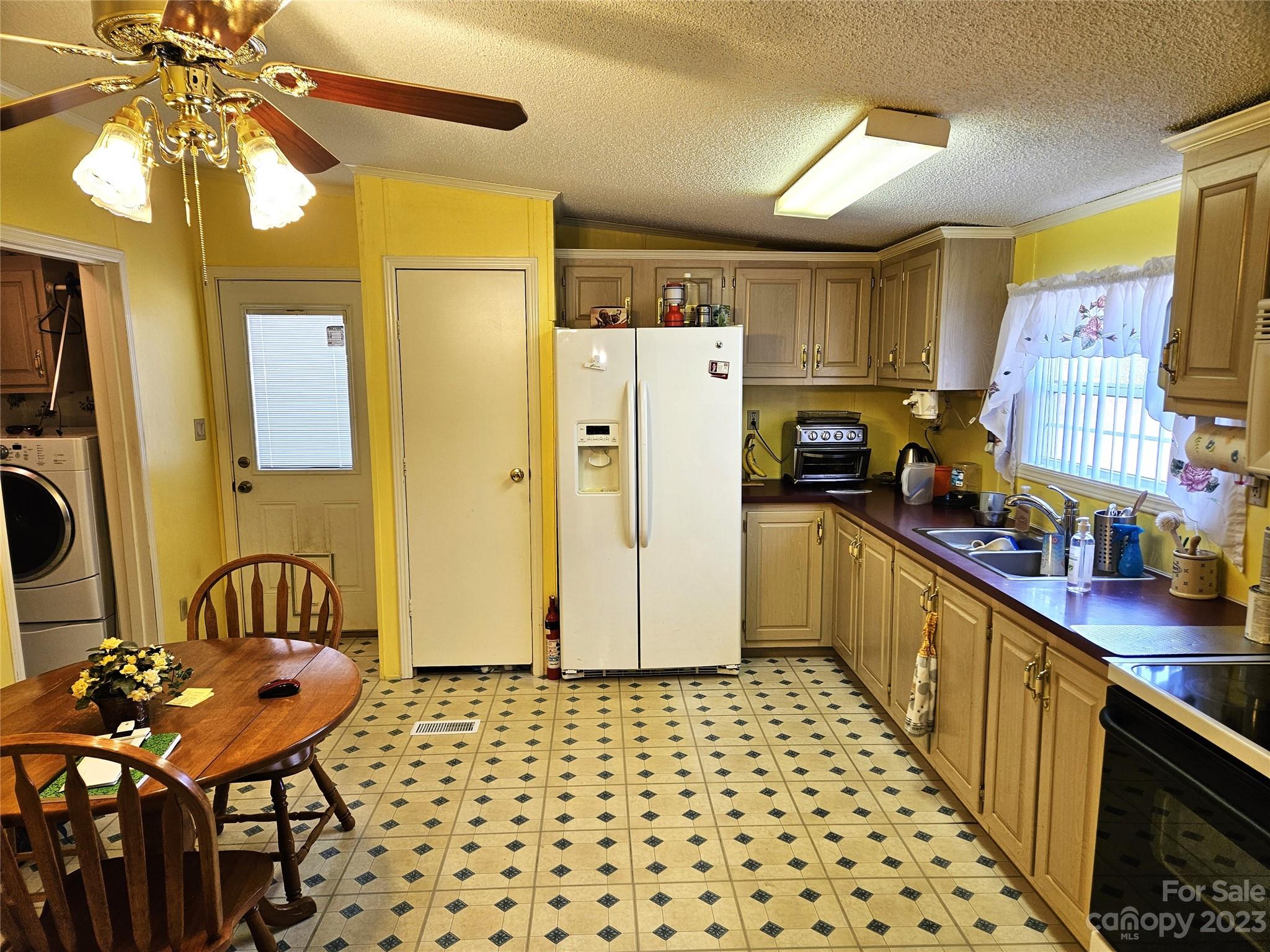 2955 Piney Road Morganton, NC 28655 - Photo 13 of 43 a kitchen with stainless steel appliances a refrigerator and a sink