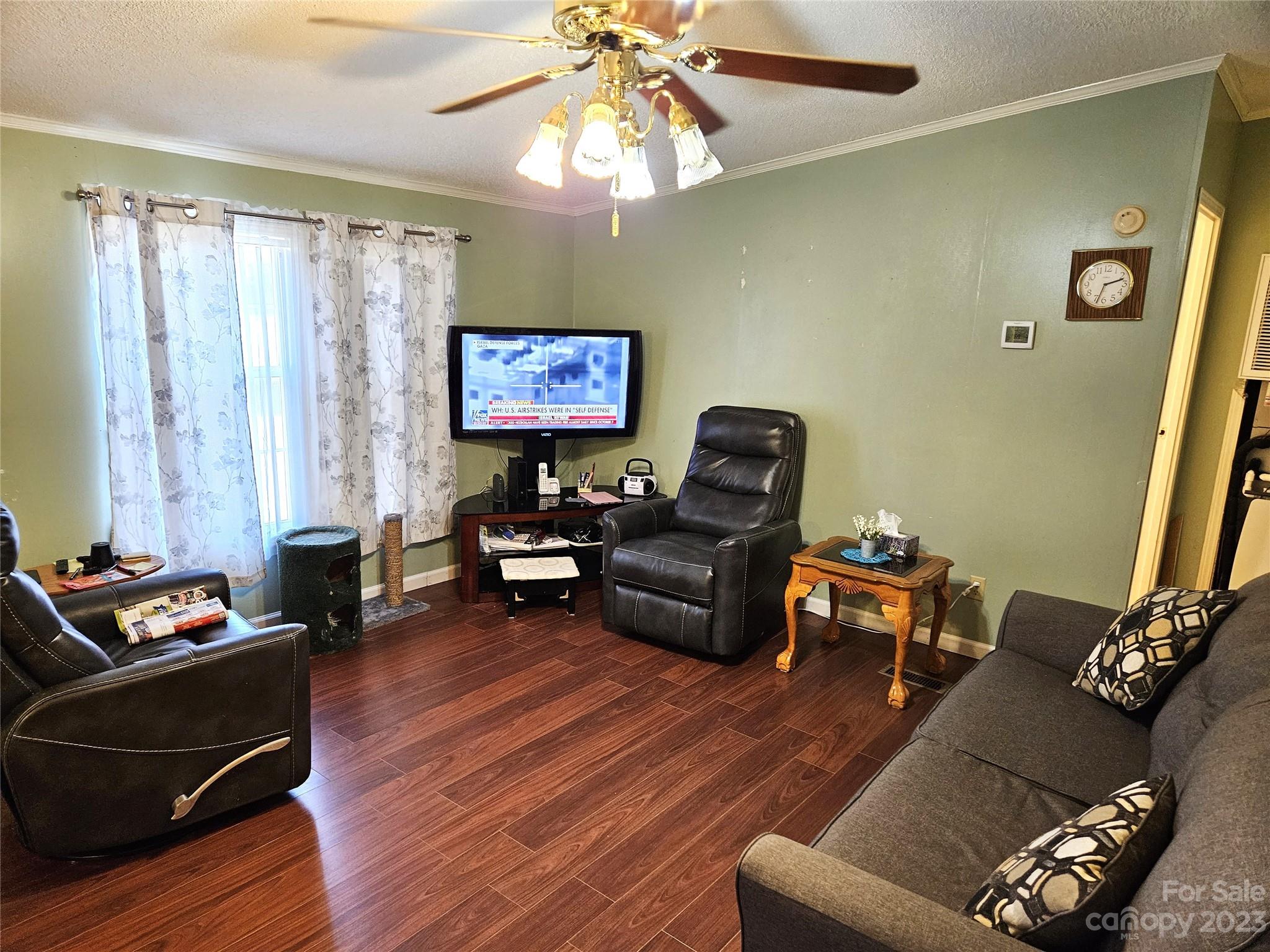 2955 Piney Road Morganton, NC 28655 - Photo 18 of 43 a living room with furniture and a flat screen tv with wooden floor