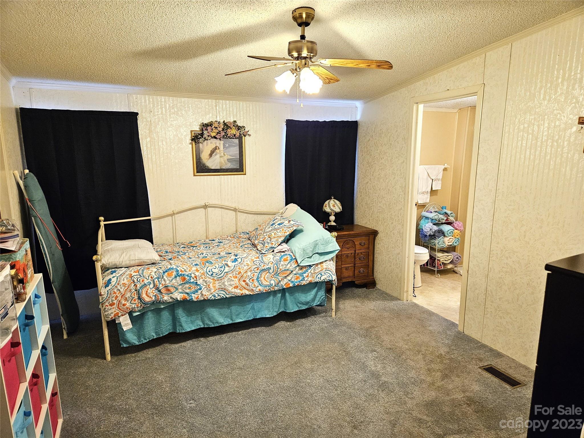 2955 Piney Road Morganton, NC 28655 - Photo 27 of 43 a bedroom with a bed and a walk in closet