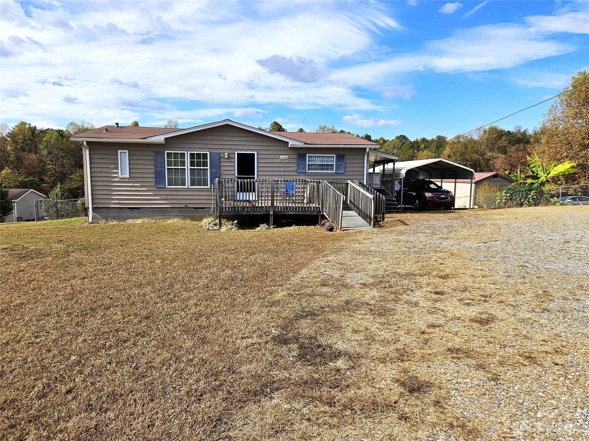 2955 Piney Road Morganton, NC 28655 - Photo 4 of 43 a front view of a house with a yard covered with snow
