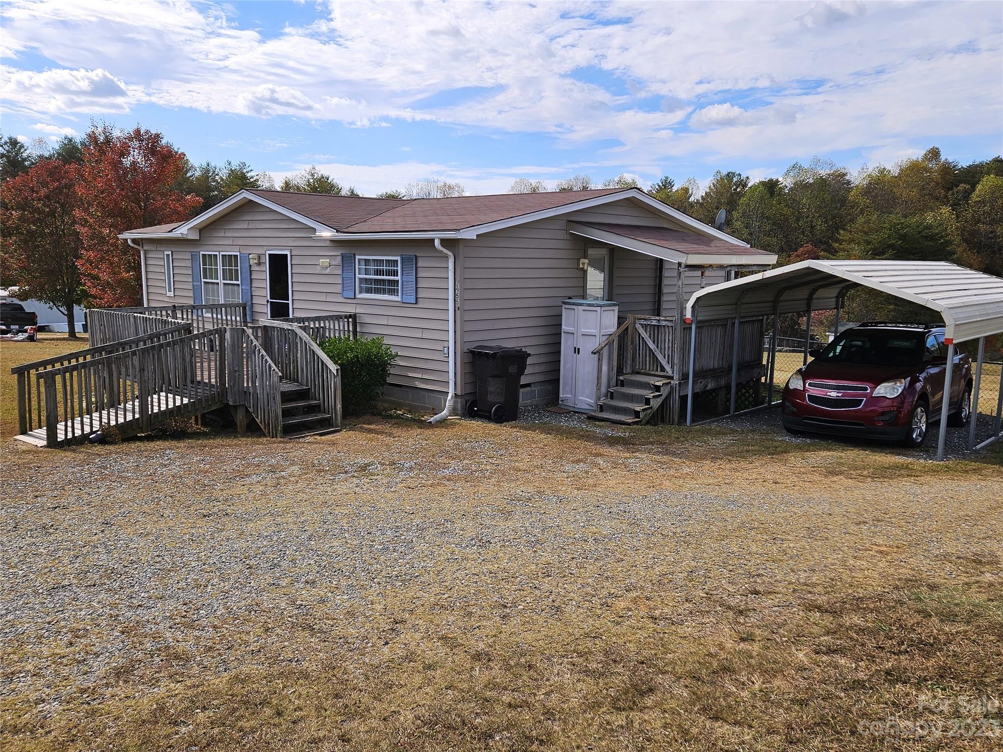 2955 Piney Road Morganton, NC 28655 - Photo 8 of 43 front view of a house with a yard and furniture