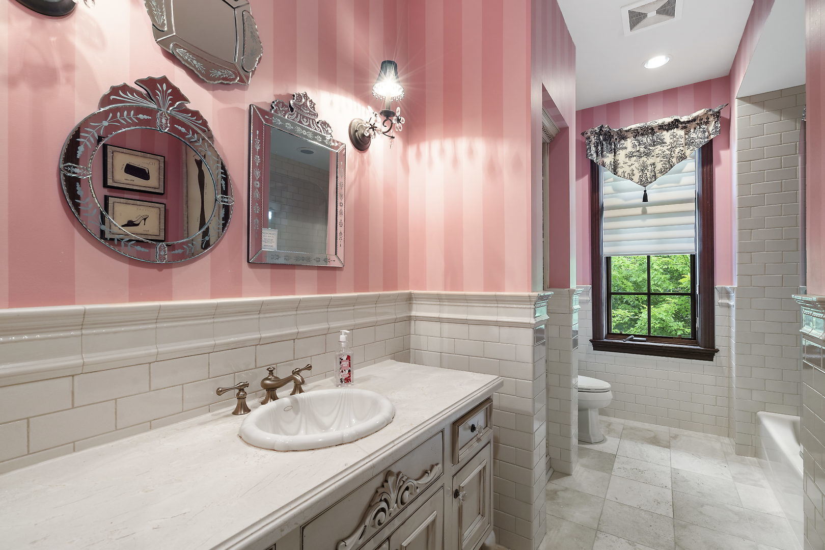 33W571 White Thorne Road St. Charles, IL 60174 - Photo 26 of 46 a bathroom with a sink vanity and a mirror
