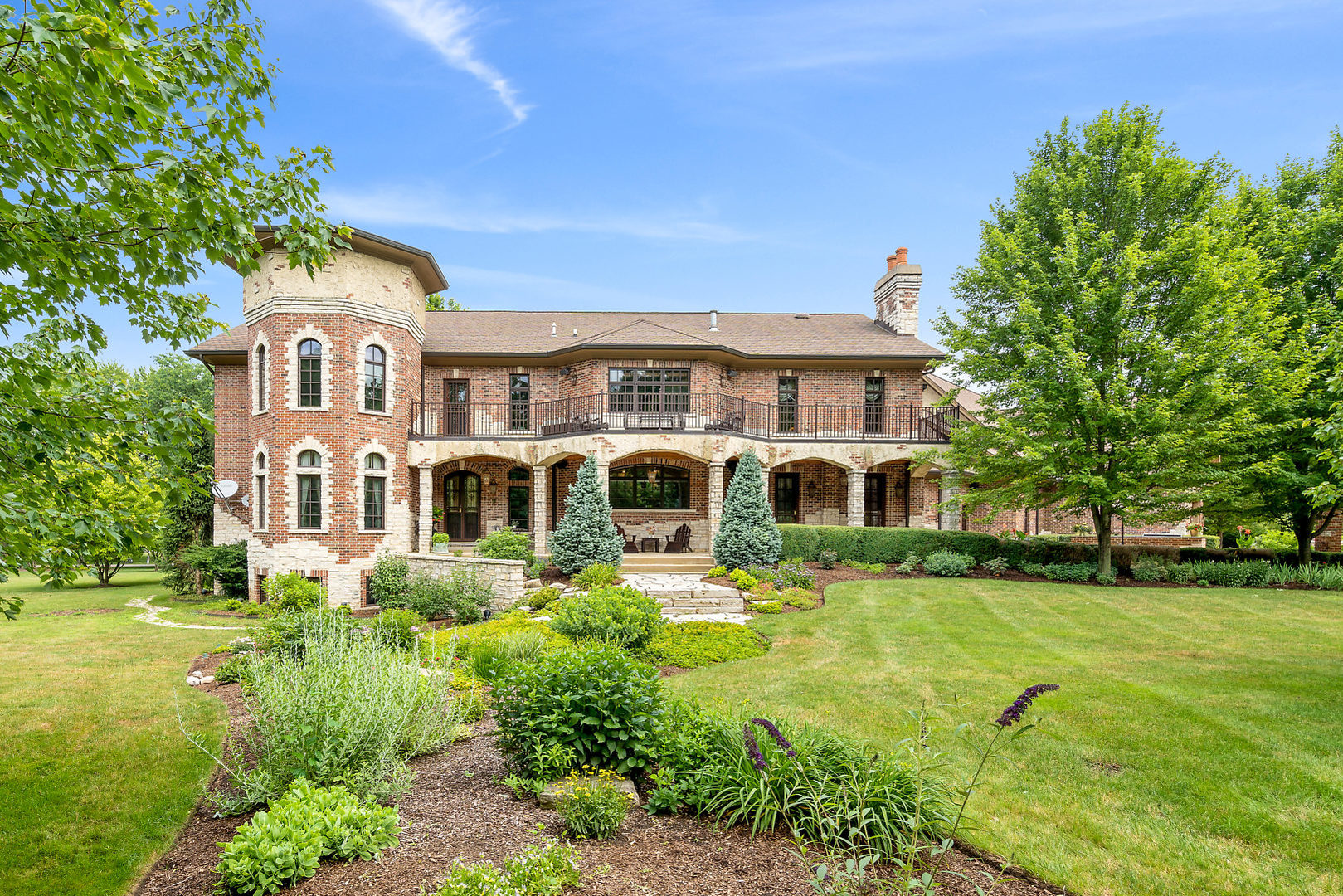 33W571 White Thorne Road St. Charles, IL 60174 - Photo 39 of 46 a front view of a house with garden and trees