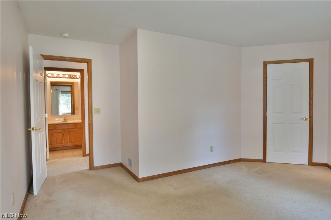 2033 East River Road, Unit 11 Newton Falls, OH 44444 - Photo 22 of 35 View of carpeted bedroom