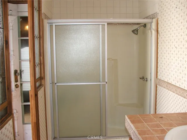 a bathroom with a shower and a tub