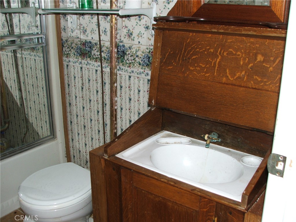 9800 Base Line Road, Unit 68 Rancho Cucamonga, CA 91701 - Photo 13 of 22 a bathroom with a sink a toilet and shower