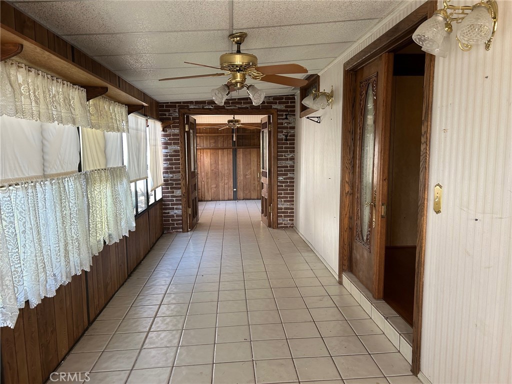 9800 Base Line Road, Unit 68 Rancho Cucamonga, CA 91701 - Photo 16 of 22 a view of a porch with wooden floor and stairs