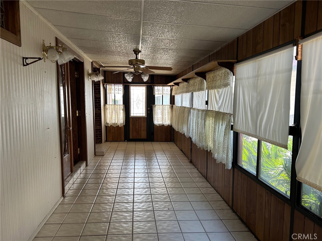 9800 Base Line Road, Unit 68 Rancho Cucamonga, CA 91701 - Photo 18 of 22 a view of a hallway with wooden floor