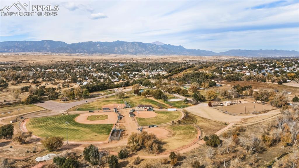 204 South Reed Street Fountain, CO 80817 - Photo 13 of 13 Aerial view of property and surrounding area with a mountain backdrop