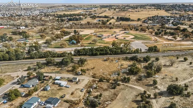an aerial view of residential houses with outdoor space