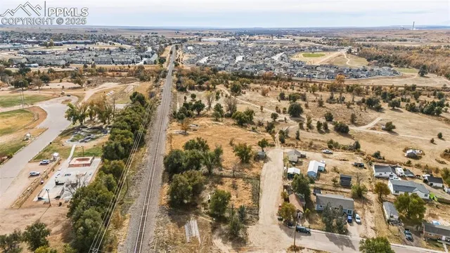 an aerial view of residential building with parking space