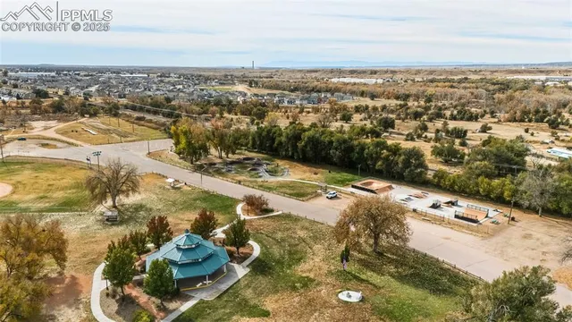an aerial view of residential houses with outdoor space