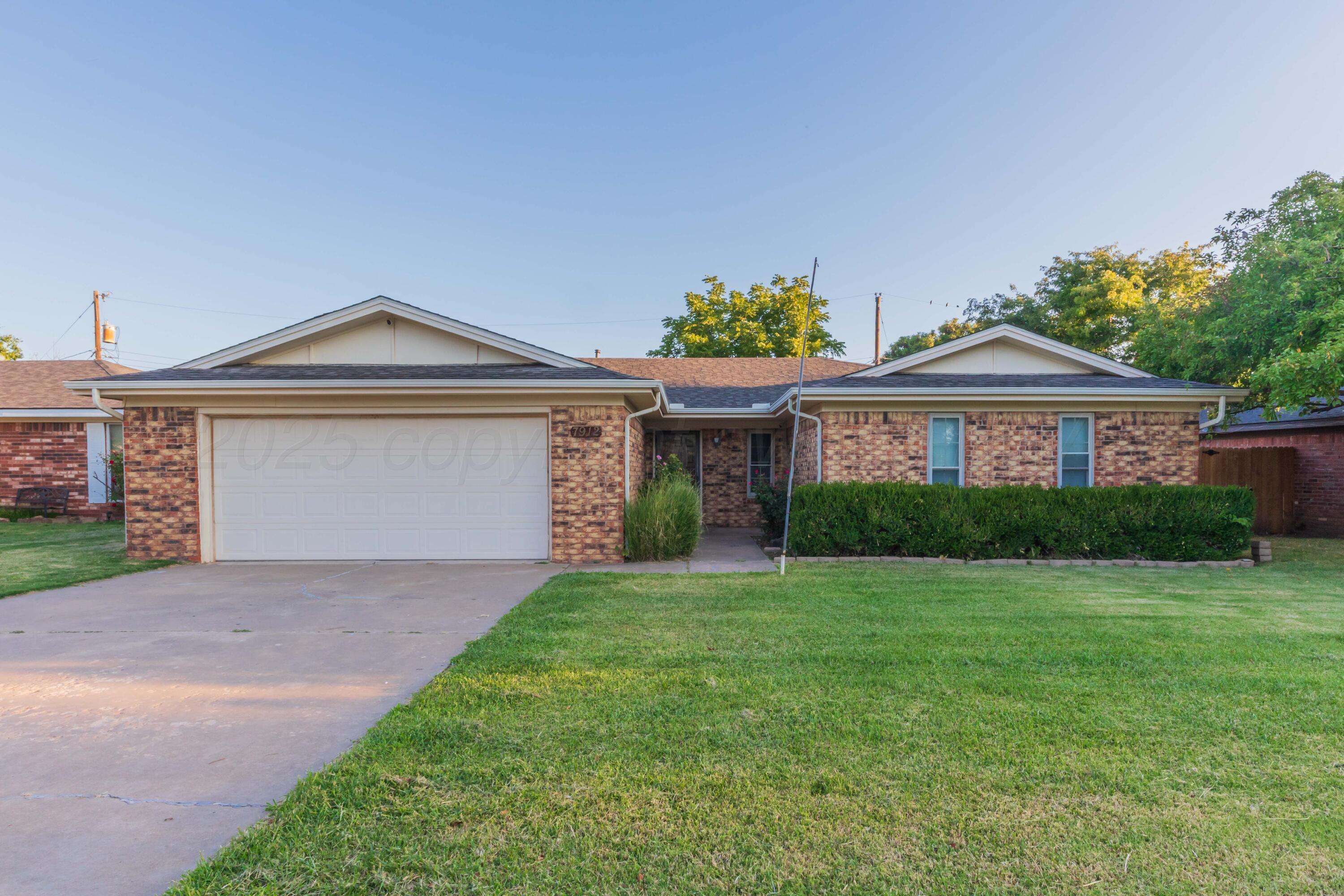 7912 Gerald Drive Amarillo, TX 79121 - Photo 1 of 45 a front view of a house with a yard and porch