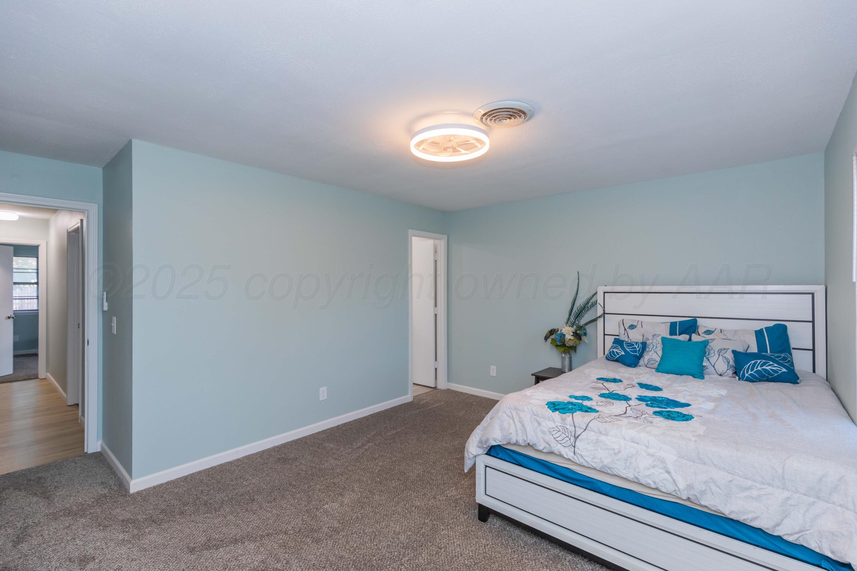 7912 Gerald Drive Amarillo, TX 79121 - Photo 21 of 45 a bedroom with bed and window