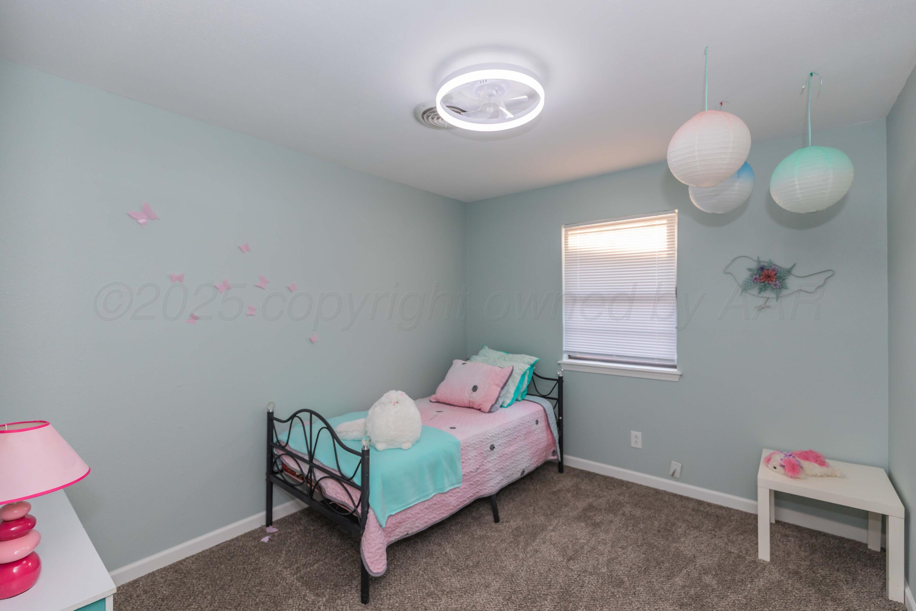 7912 Gerald Drive Amarillo, TX 79121 - Photo 33 of 45 a bedroom with a bed and window