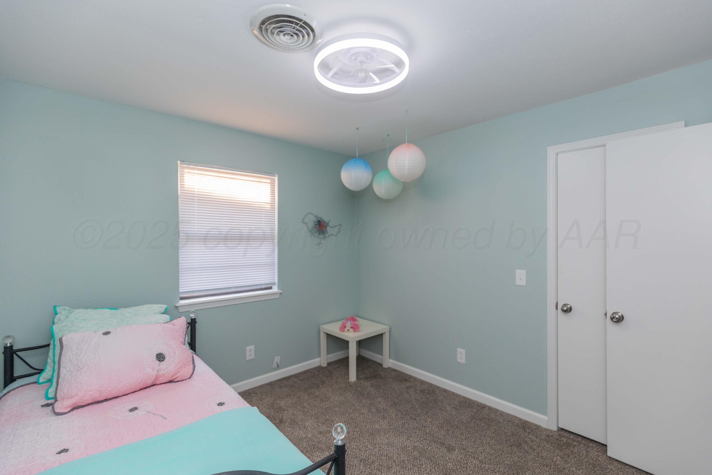 7912 Gerald Drive Amarillo, TX 79121 - Photo 34 of 45 a room with toys and a window