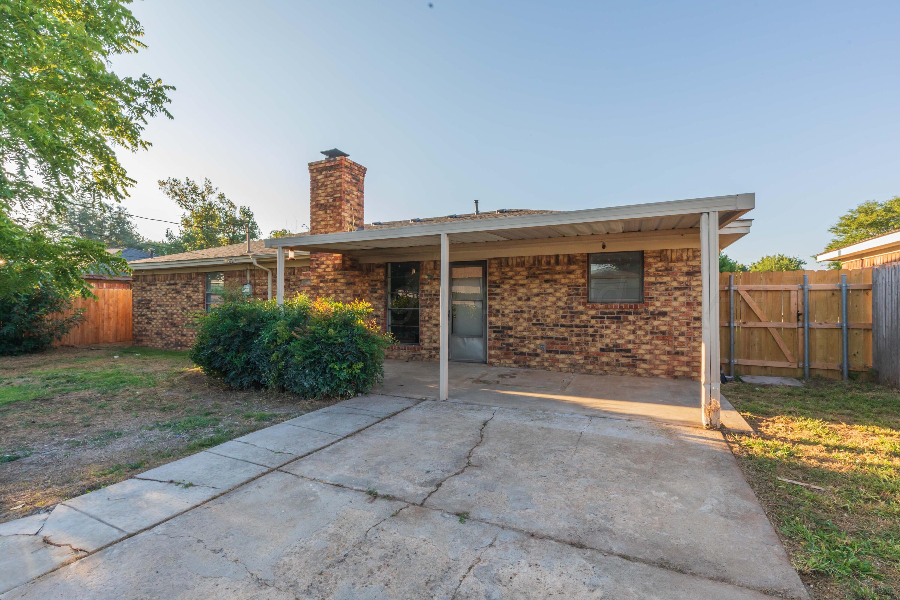 7912 Gerald Drive Amarillo, TX 79121 - Photo 40 of 45 a front view of a house with garden