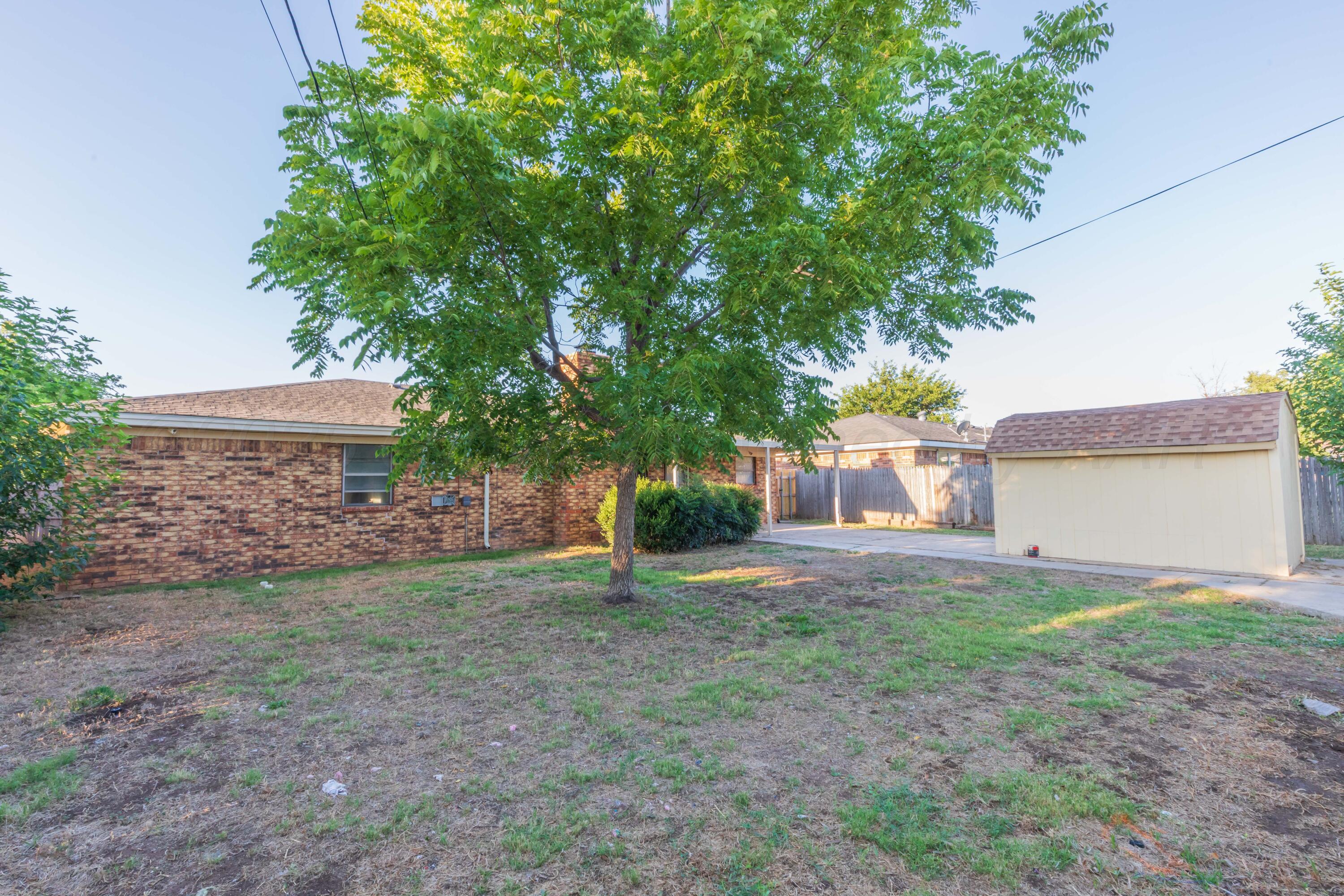 7912 Gerald Drive Amarillo, TX 79121 - Photo 42 of 45 a view of a house with a yard and garage