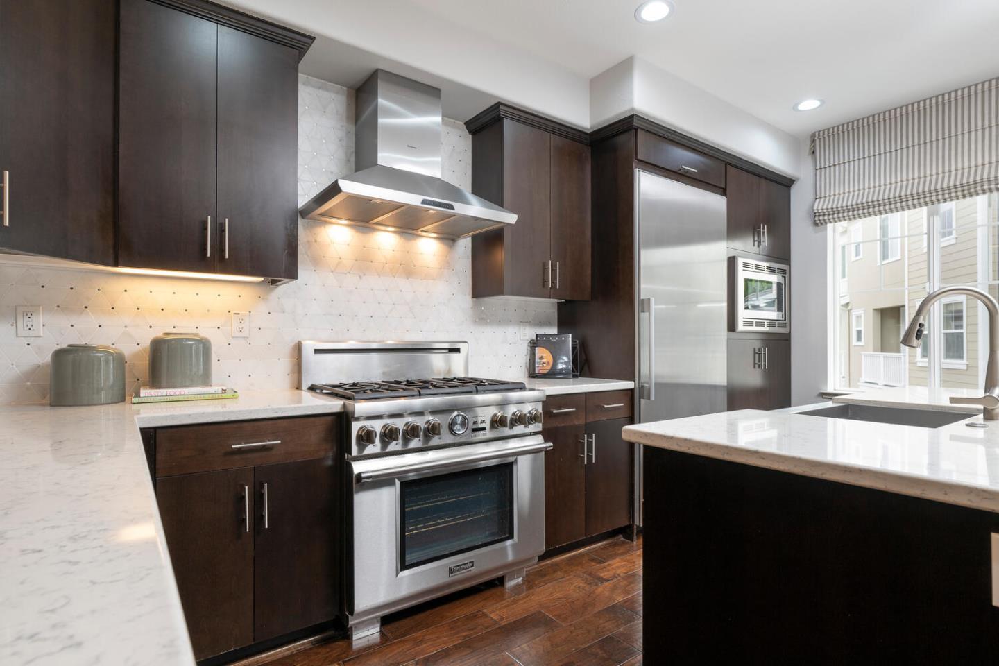 2903 Baze Road San Mateo, CA 94403 - Photo 11 of 31 a kitchen with a stove and a sink