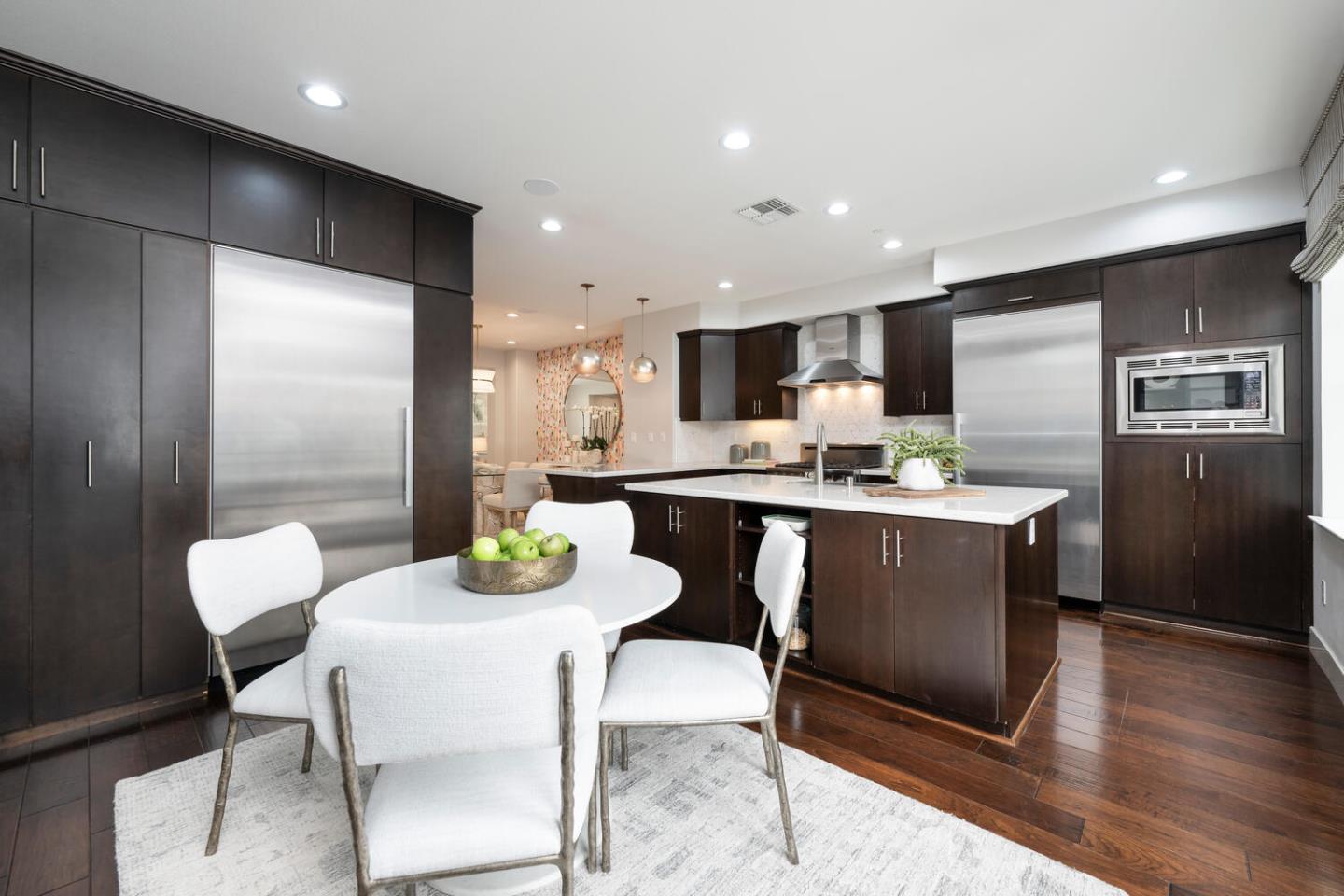 2903 Baze Road San Mateo, CA 94403 - Photo 13 of 31 a kitchen with a table chairs and a refrigerator