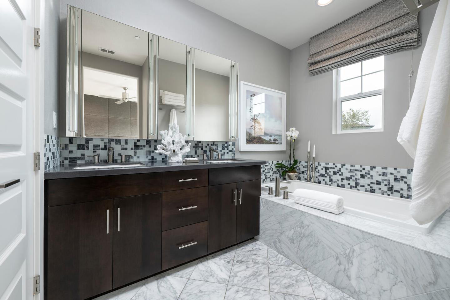 2903 Baze Road San Mateo, CA 94403 - Photo 18 of 31 a bathroom with a sink and a mirror
