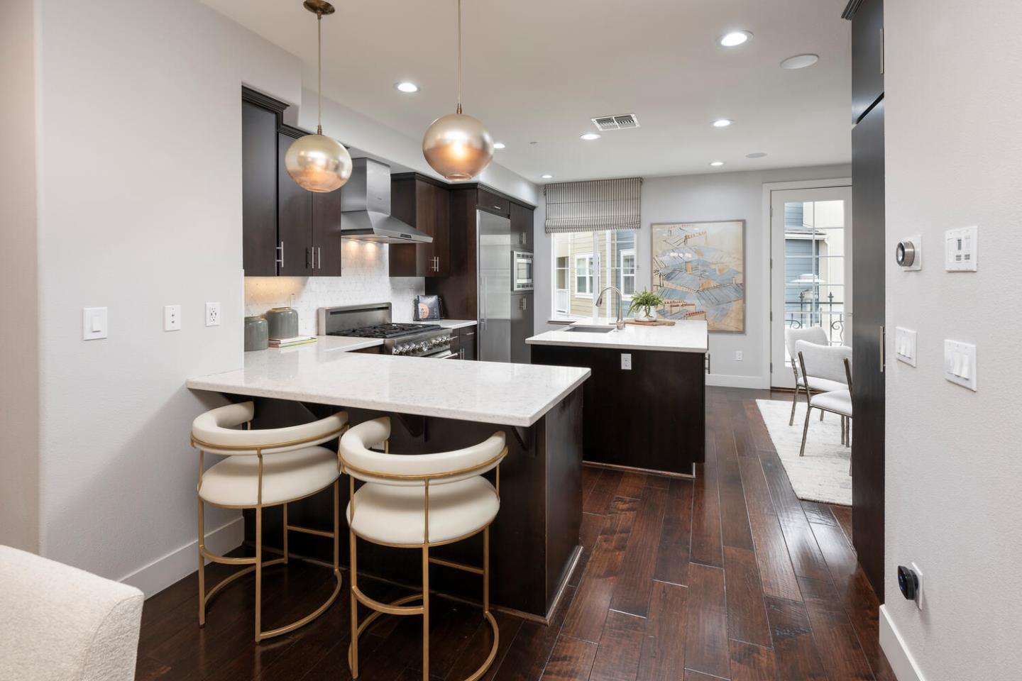 2903 Baze Road San Mateo, CA 94403 - Photo 10 of 31 a kitchen with a dining table chairs sink and cabinets
