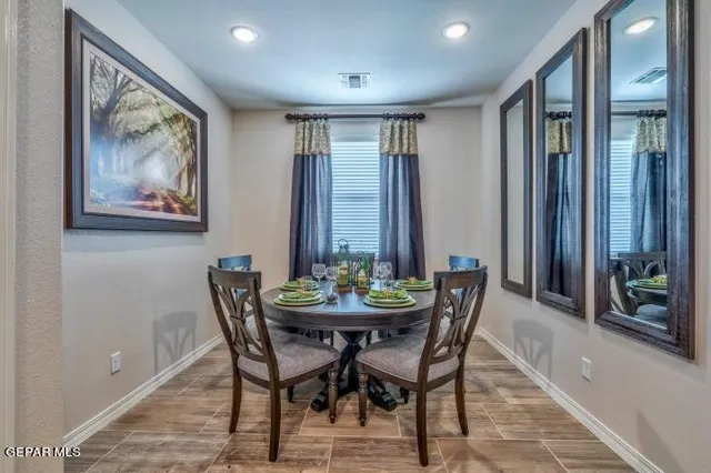a view of a dining room with furniture window and outside view