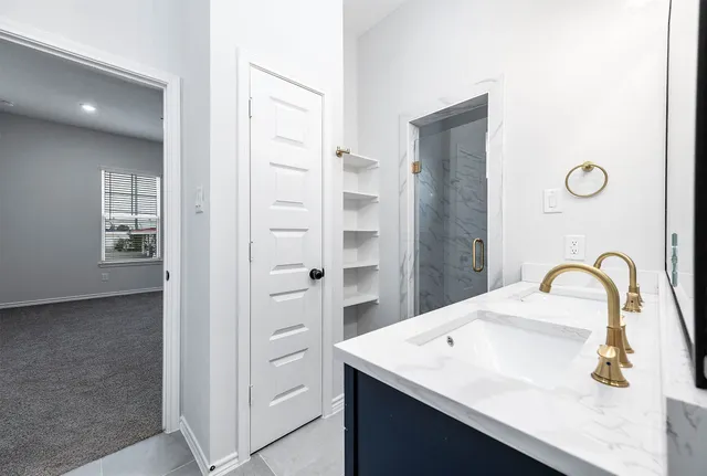 a bathroom with a sink and mirror