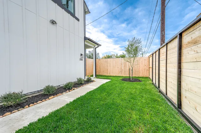 a view of a backyard with potted plants