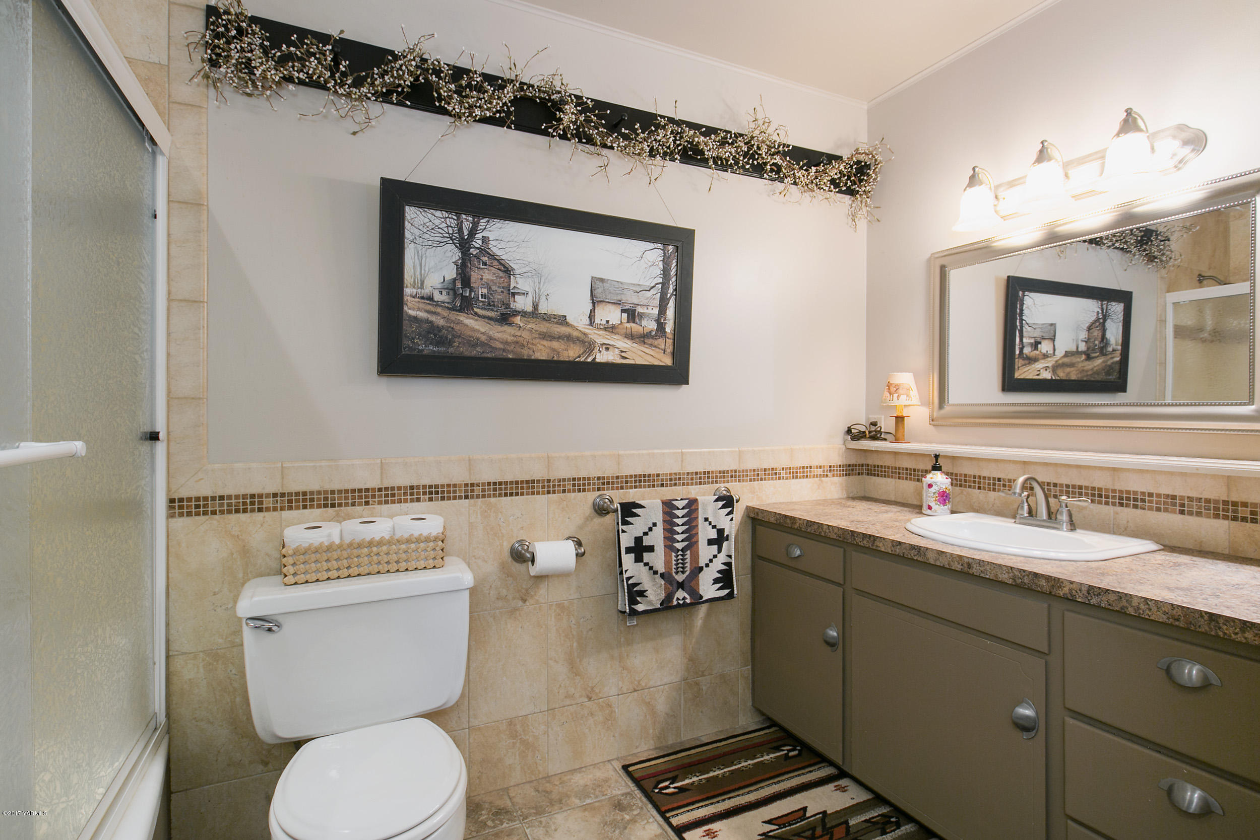 7503 Bittner Road Yakima, WA 98901 - Photo 13 of 31 a bathroom with a toilet a sink and mirror